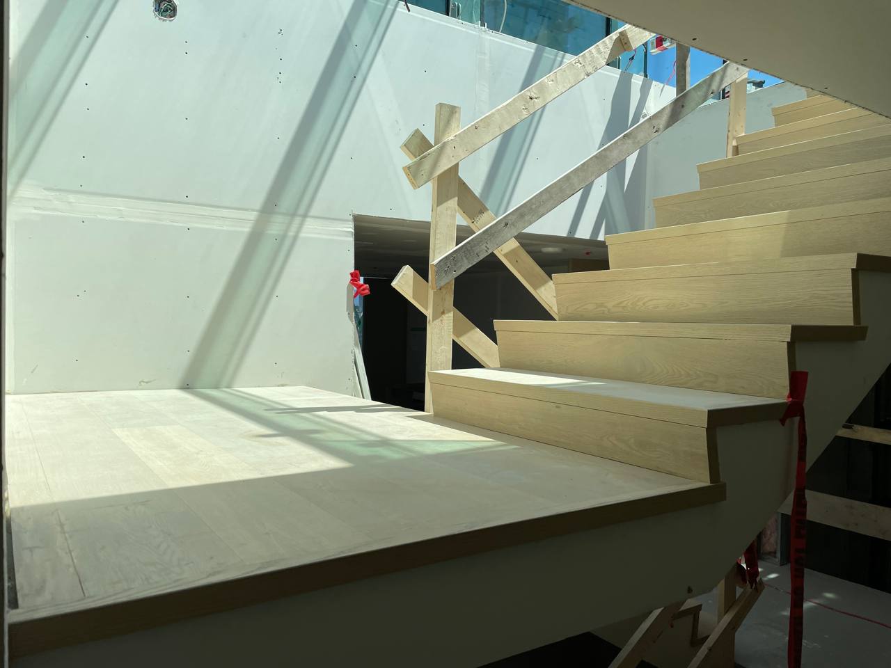 Double open‑end hardwood staircase at Mirabel